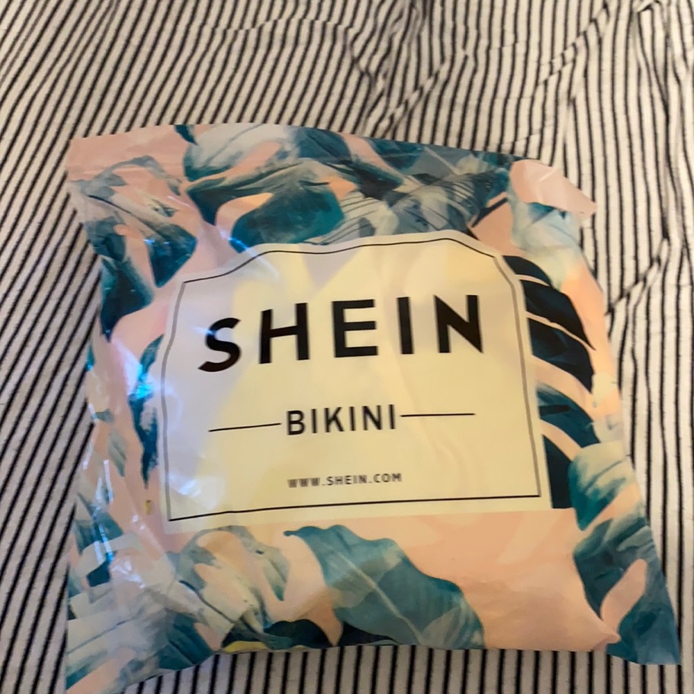 Neon yellow bathing suit with low back and wrap.